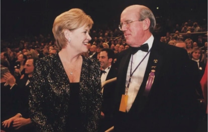 A man and woman in tuxedos attended the Westminster Kennel Club show.