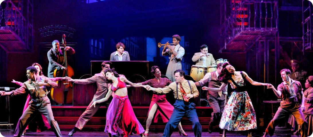 A group of people on stage performing a musical.