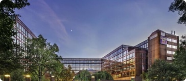 An image of an office building at dusk.