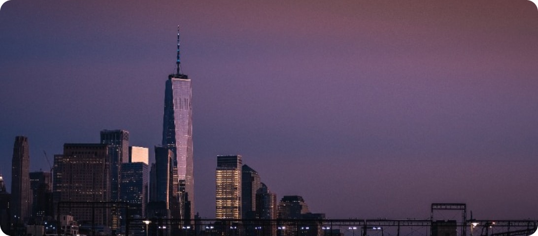 The skyline of new york city at dusk.