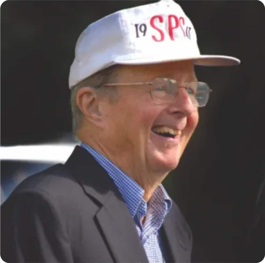 A man wearing a hat with the word spc on it.