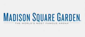 Logo of Madison Square Garden with the text "Madison Square Garden" in blue and "The World's Most Famous Arena" in gray below it, reminiscent of the grand hotels that surround the area.